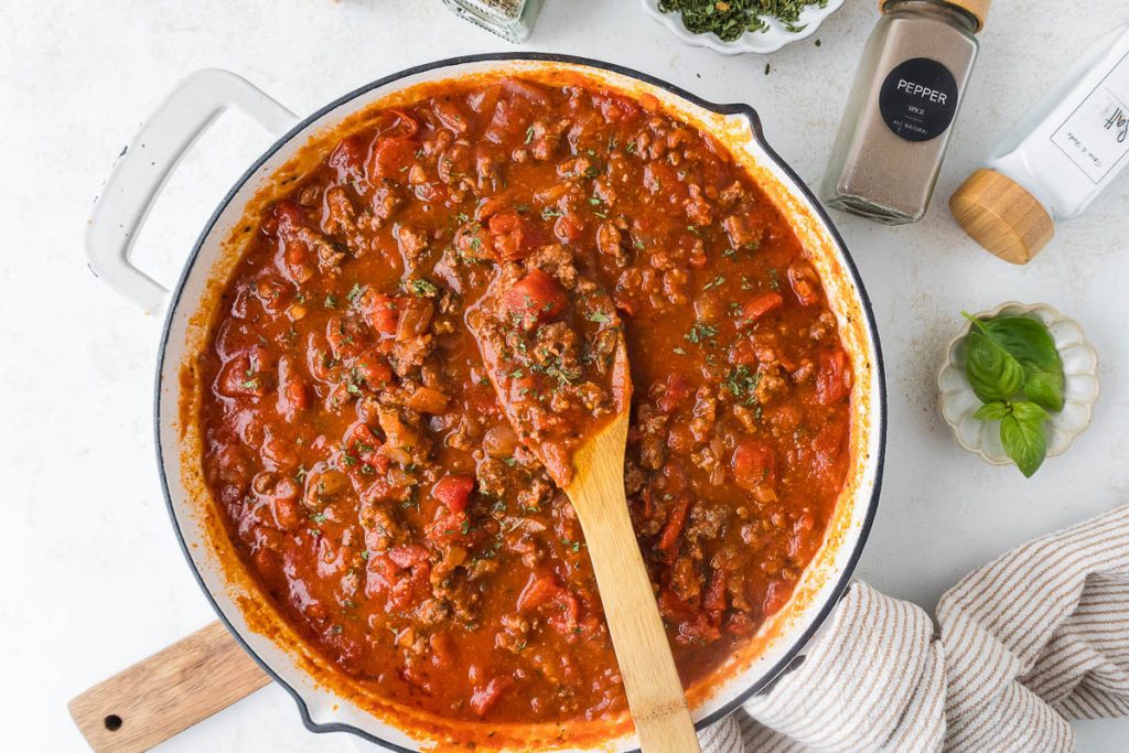 Italian Pasta with Ground beef sprinkled with dried parsley on the top.