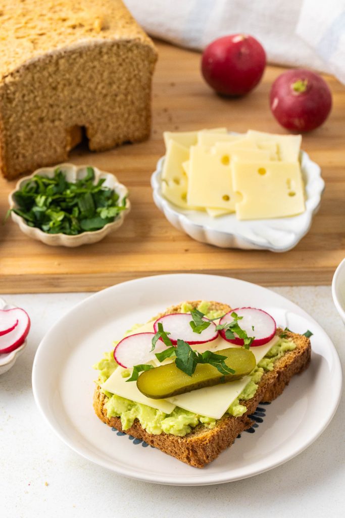 toast with avocado, radish, pickle and parsley.