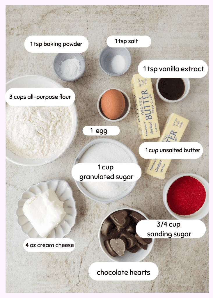 ingredients for cookies - flour, buttter, vanilla extract, egg, cream cheese, baking powderm salt, chocolate hearts