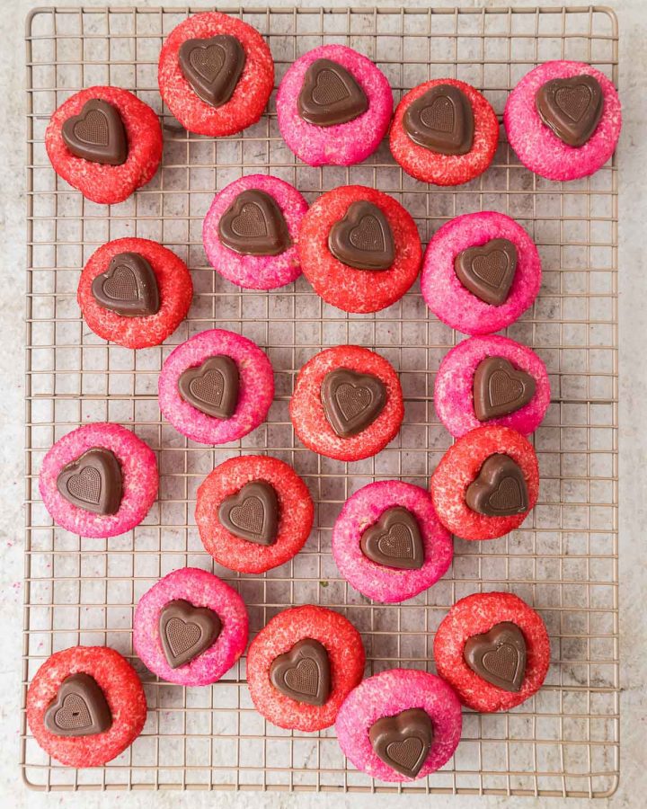 Close-up of soft chocolate heart-shaped cookies arranged on a cooling rack. perfect for a sweet homemade treat.