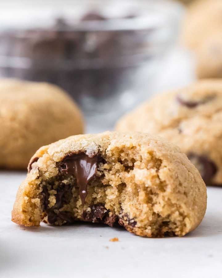 Freshly milled barley chocolate chip cookies stacked on a plate, soft and chewy homemade cookies made with whole grain barley flour.