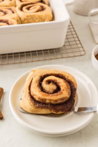 Soft, fluffy cinnamon rolls made with freshly milled flour, topped with creamy icing.