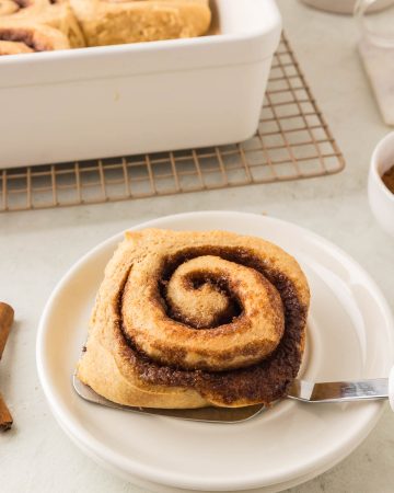 Soft, fluffy cinnamon rolls made with freshly milled flour, topped with creamy icing.