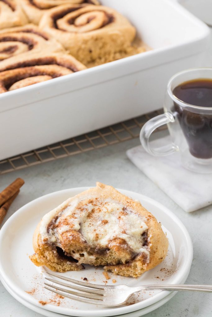 piece of cinnamon roll on the table with icing