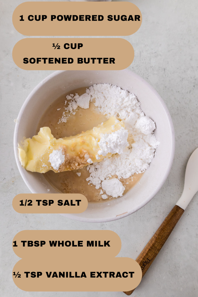 Ingredients for icing in the bowl- powdered sugar, softened butter, vanilla extract, milk, salt