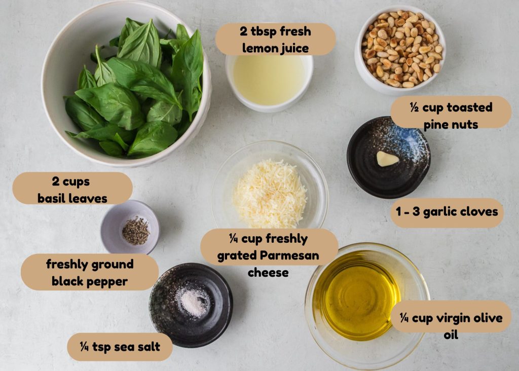 ingredients for the pesto- basil, garlic, olive oil, parmesan cheese, pepper, salt and pine nuts
